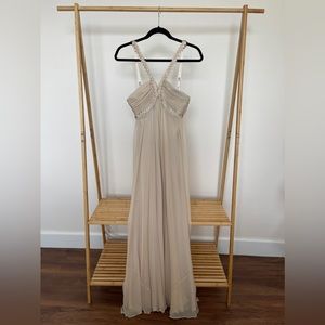 BCBGMaxAzaria Champagne Formal Gown with Flowing Fabric and Detail at chest